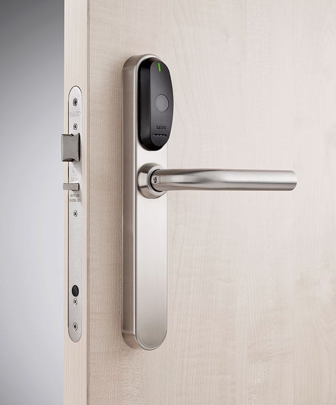 Beech coloured wooden door with Salto security door handle.